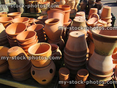 Stock image of stack of terracotta pots / planters in garden centre
