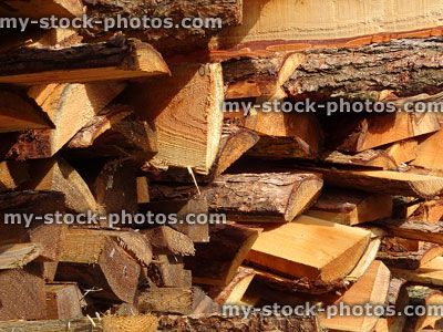 Stock image of split larch logs at lumber yard / timberyard, firewood