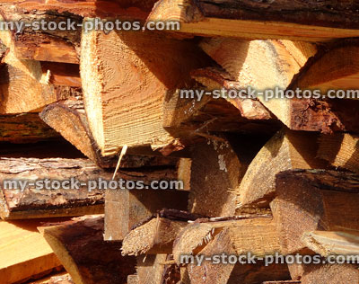 Stock image of split logs at lumber yard / timberyard firewood bundles