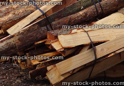 Stock image of firewood bundles of split logs, softwood, larch / pine