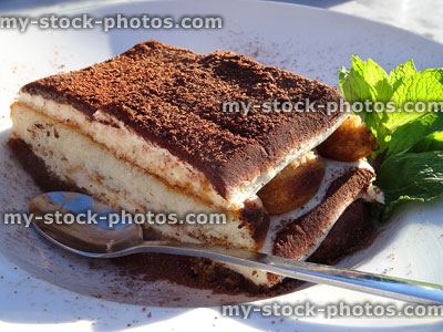 Stock image of restaurant dessert, layered tiramisu cake with coffee liqueur