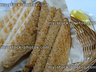 Stock image of white and brown bread toast, wholemeal toast, breakfast wicker basket
