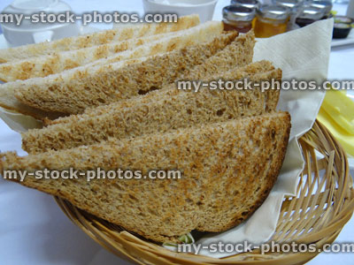 Stock image of white and brown bread toast, wholemeal toast, breakfast wicker basket