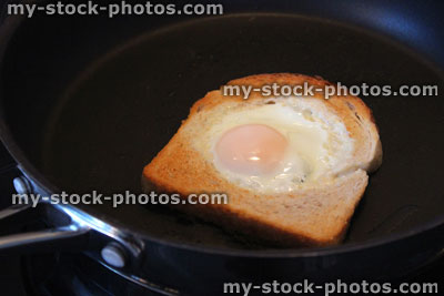 Stock image of egg in hole toast / fried bread with egg