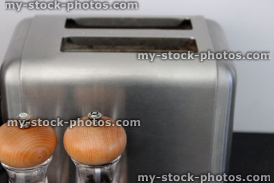 Stock image of stainless steel chrome toaster, salt and pepper mills