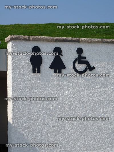 Stock image of man, women, disabled wheelchair signs outside public toilets