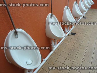 Stock image of public toilet urinals for men, gent's public toilet