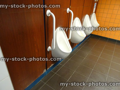 Stock image of white china men's urinals / public toilets, 'The Gents'