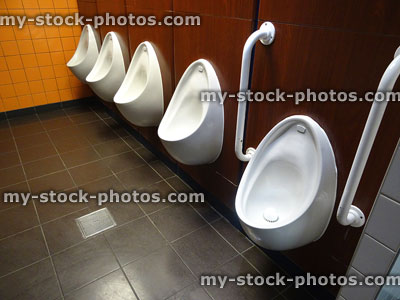 Stock image of individual men's urinals, public toilets restroom, 'The Gents'