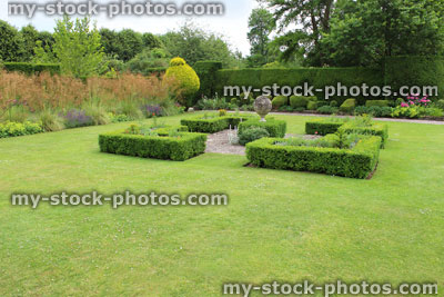 Stock image of landscaped knot garden with geometric clipped box hedging