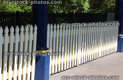 Stock image of white picket fence on platform of railway station