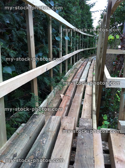 Stock image of wooden tree walkway in a domestic garden (close up)