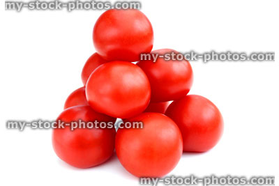 Stock image of fresh organic tomatoes and cherry tomatoes, isolated background