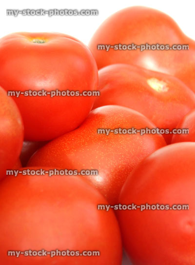 Stock image of fresh, red salad tomatoes in pile, health benefits, vitamins