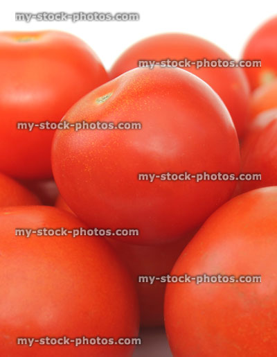 Stock image of fresh, red salad tomatoes in pile, healthy vegetable fruit
