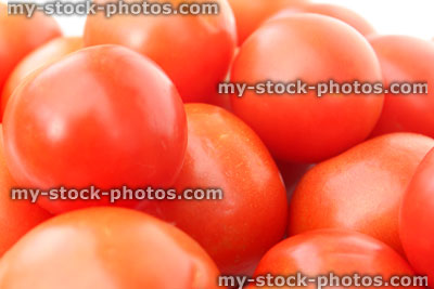 Stock image of fresh, red salad tomatoes in pile, healthy eating