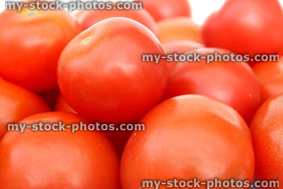 Stock image of fresh, red salad tomatoes, health benefits, vitamins, fibre