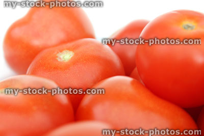 Stock image of fresh, red salad tomatoes in pile, vitamins, beta caratene