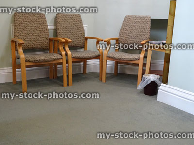 Stock image of brown cushion chairs in hospital / doctor's waiting room