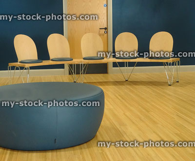 Stock image of doctor's waiting room at hospital, modern seating easy to clean