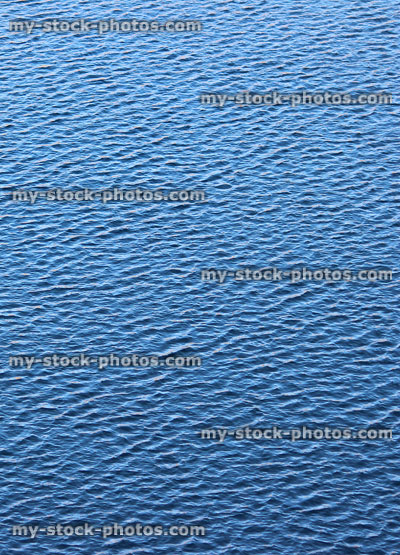 Stock image of small blue ripples on water's surface of lake