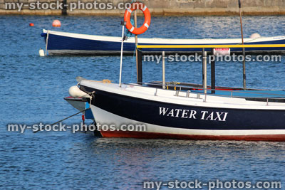 Stock image of water taxi boat in seaside harbour / beach / sea