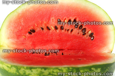 Stock image of water melon sliced to show red flesh inside