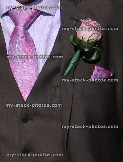 Stock image of bridegoom / groom at wedding, buttonhole rose, suit, tie, handkerchief
