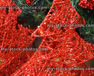 Stock image of wicker Christmas trees / decorations, painted with sparkling red glitter paint