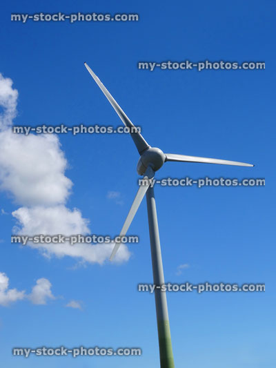 Stock image of efficient, modern low wind turbine windmill on wind farm