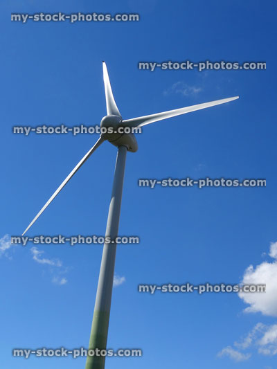 Stock image of three blades forming wind turbine windmill, sky background