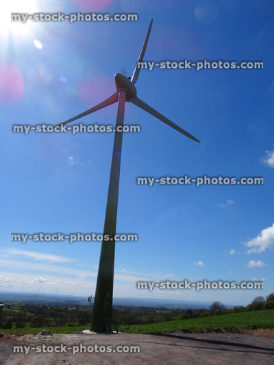 Stock image of windmill / wind turbine turning wind into green electricity