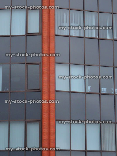Stock image of modern office block with glass windows and reflections