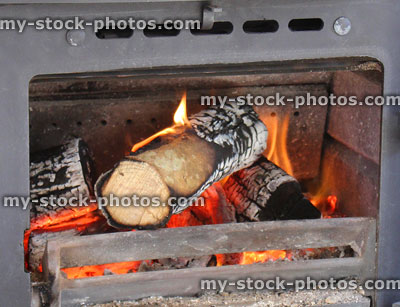 Stock image of flames / fire inside cast iron woodburning stove, burning logs
