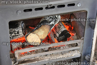 Stock image of fire grate, flames / burning logs, woodburner stove fireplace