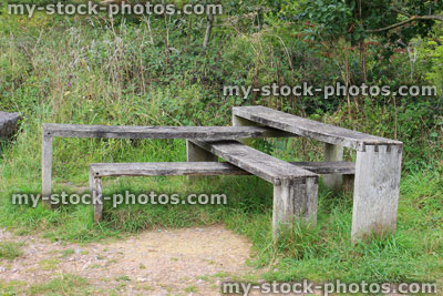 Stock image of L shaped, angular interlocking wooden benches in public park