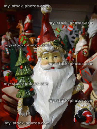 Stock image of wooden ornamental Santa Claus / Father Christmas statue, white bushy beard