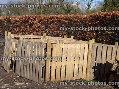Stock image of wooden compost heaps made from pallet wood crates