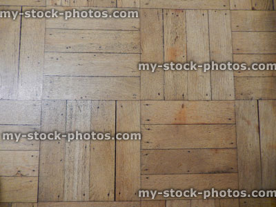 Stock image of old, reclaimed varnished parquet floor, wooden parquet flooring, light oak