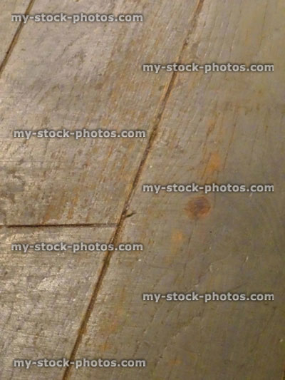 Stock image of old, worn wooden floorboards, medium oak wood floor