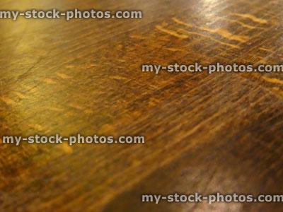 Stock image of worn, varnished, distressed antique medium oak wooden table top