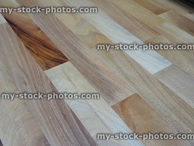 Stock image of oak-effect laminate wooden flooring in hallway, home interior
