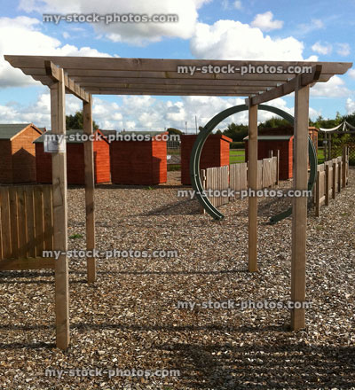 Stock image of new rectangular timber / wooden pergola in garden centre