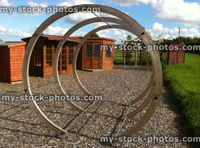 Stock image of circular pergola made from curved wood, round tunnel