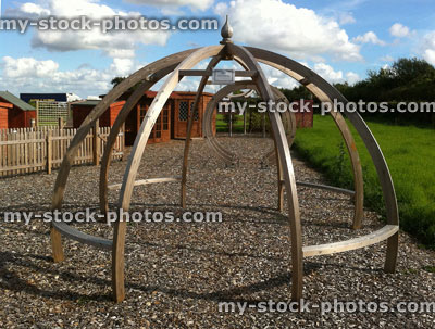 Stock image of dome pergola made from tanalised timber wood frame