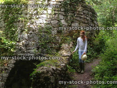 Stock image of girl beside a woodland ruin