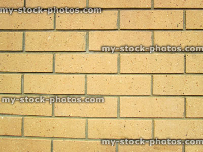 Stock image of modern yellow brick wall of house, brick pattern