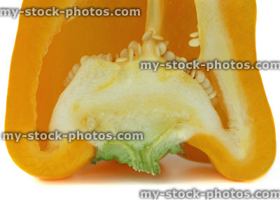 Stock image of large yellow pepper / capsicum, raw vegetable, sliced in half
